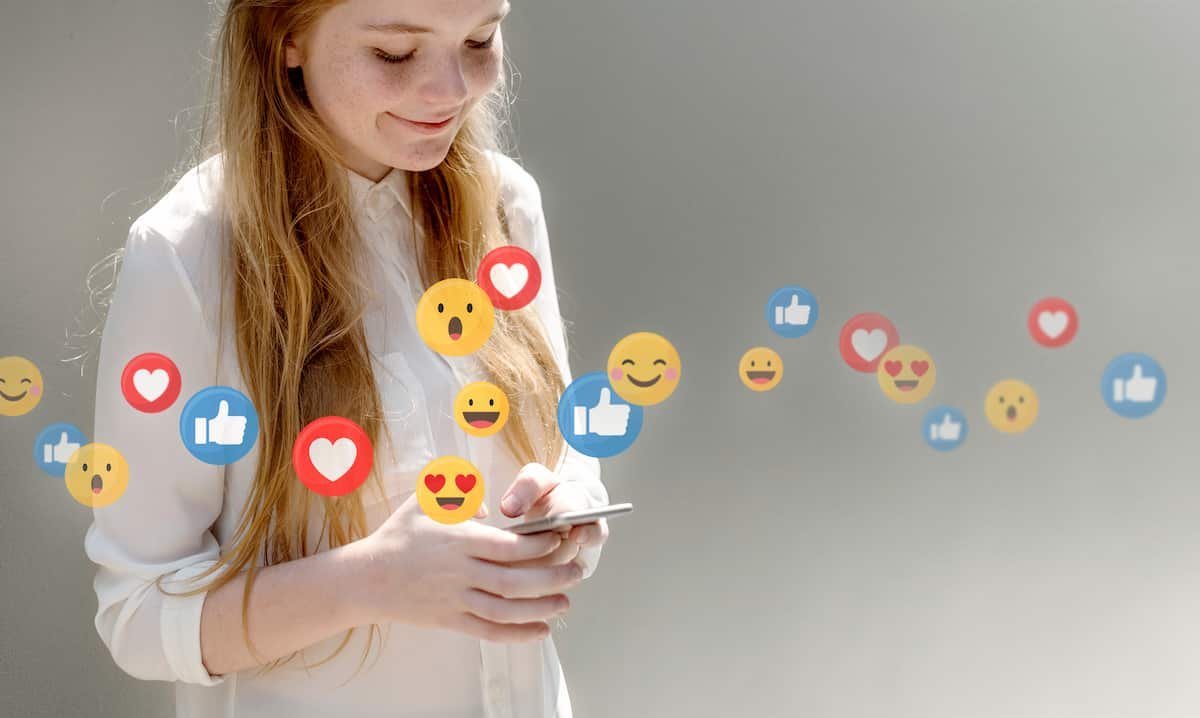 young woman watching live stream 1 Social Media Strategies Eighteen Webs